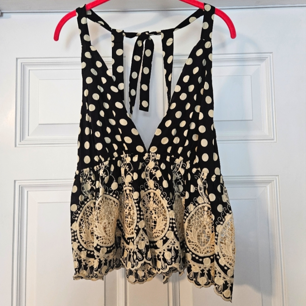 Free people top size XS. Black w cream Polkadots.          A